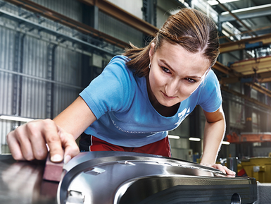 An employee of the EBZ Group works at the plant.